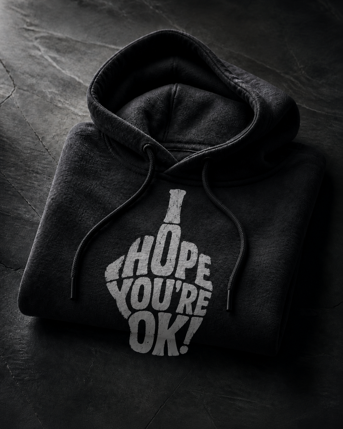 Folded black hoodie with I Hope You're OK design